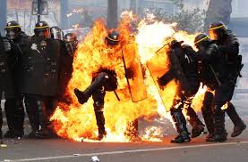 French police, set on fire by violent protestors.