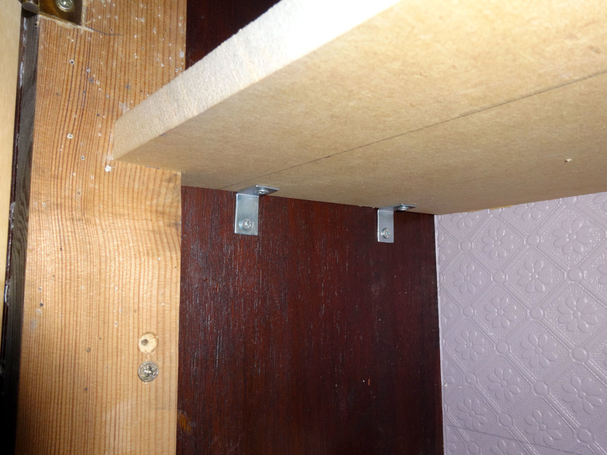 Shelves fitted with small angle brackets.