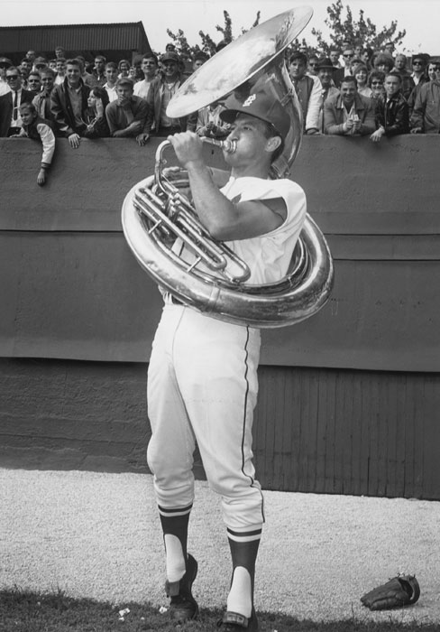 Bob Uecker playing a sousaphone in the outfield before Game 1 of the 1964 World Series.