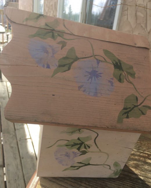 Side view of bird house with stencil painting