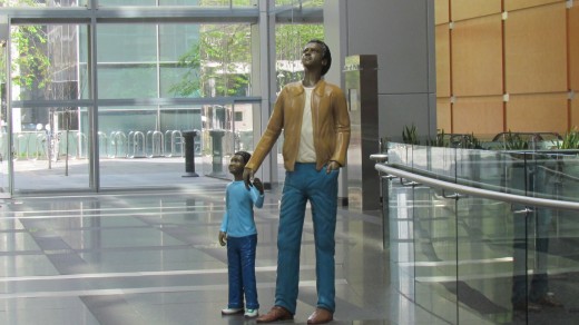 A statue that is featured in the Comcast Center of a father and son, located downtown Philadelphia at 1701 John F. Kennedy Blvd.