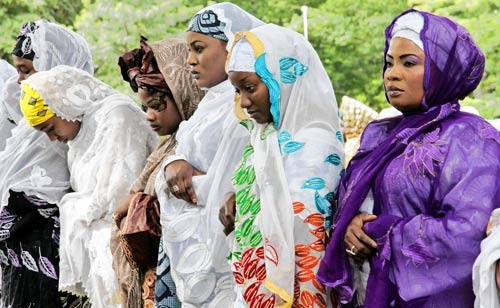 Muslim Women worshiping Allah through prayer. 