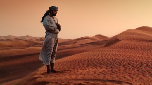 Desert  Bedouin Muslim Praying in the evening to Allah. 