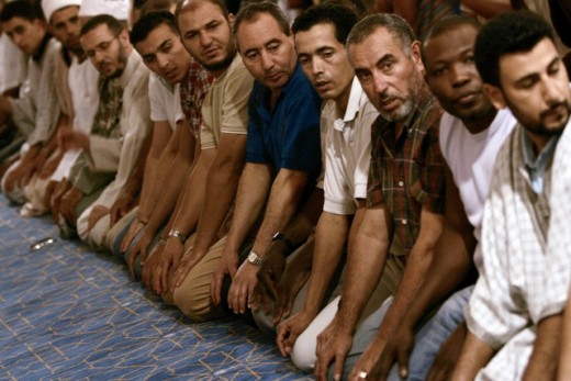 Muslims in Spain worshiping through prayer to Allah. 