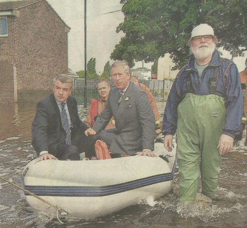 The Man From The Post Office Standing Alongside Prince Charles In A Rubber Dinghy!