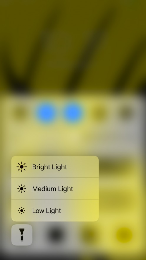The 3D Touch menu for flashlight intensity lets you choose between Bright Light, Medium Light, and Low Light.