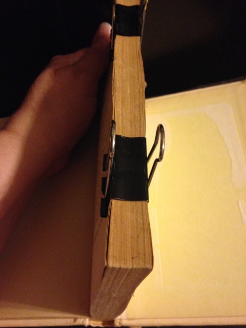 Clip only the pages together; don't clip to the back of the book.