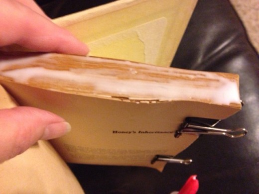 The glue dries clear and adheres the pages together.