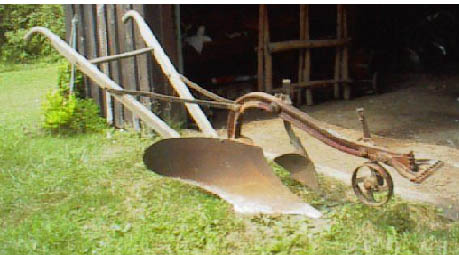 Vintage breaking plow to break up  the new ground.