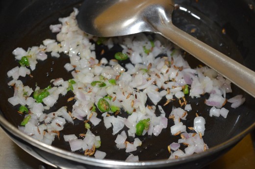 Step three: Saute cumin seeds, chopped green chilies, and chopped onion.