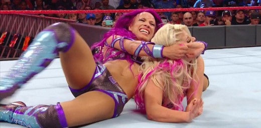 Sasha Banks slaps the 'Bank Statement' on Alexa Bliss. Photo: WWE