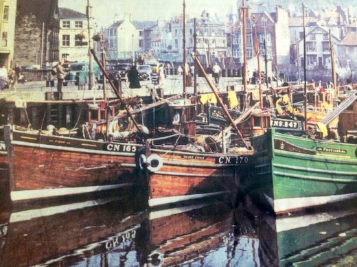 Whitby Harbour in the mid-1950s, with fishing vessels crowding the water. Fish & Chips could be had at the time for 2/- or 'two bob' (two shillings then, now worth 10p since devaluation of the pound twice)