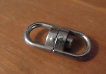 A double loop connector used in jewellery making. 