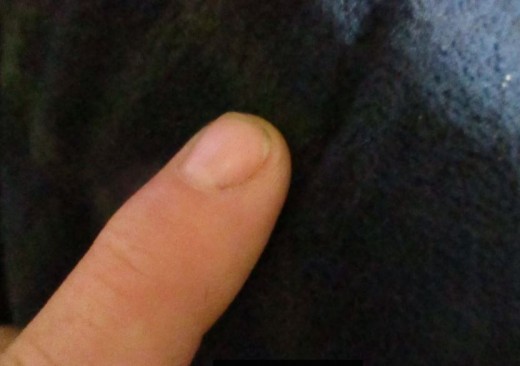 You must use your finger to feel. Actually, you use both hands to read braille.