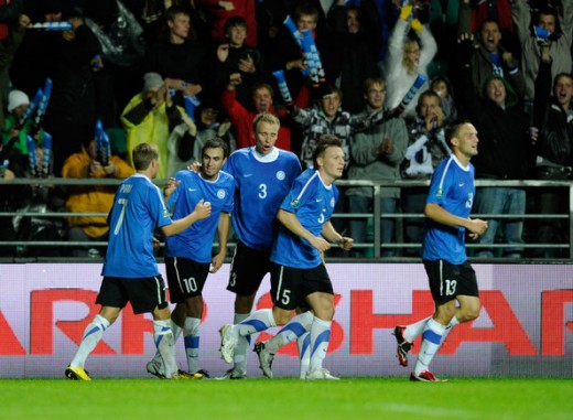 Estonian players congratulate Sergei Zenjov after Estonia opened its Euro 2012 qualifier against Italy with a goal. Despite the 2-1 loss, Estonia would do enough to earn a shock playoff berth one year later.