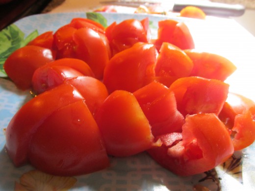 Tomatoes cut in chunks to be pureed.