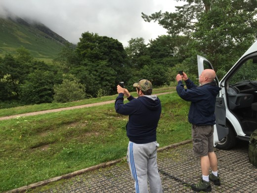 Steve and Rob taking pictures of low based cloud partly obscuring mount Meall an t-Suidhe.