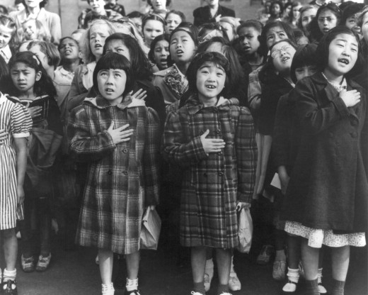 Dorothea Lange's pledge of allegiance photo, highlighting racial diversity and the allegiance of all Americans to the nation, while simultaneously Japanese Americans were interned based solely upon their race. 
