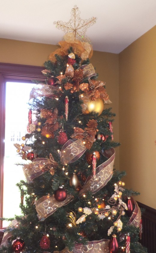 This tree almost touches the ceiling. Disney decorates not just Walt Disney World but all the resort hotels associated with it.  This tree, decorated by the same professionals who decorate the parks, is located at Solivita just south of Kissimmee