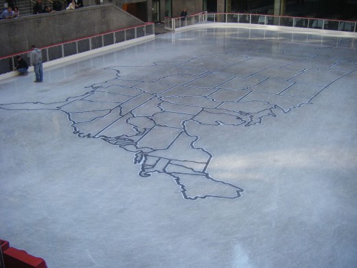 Rockerfeller Plaza's ice rink early in the morning prior to skaters icing over the state map of the USA
