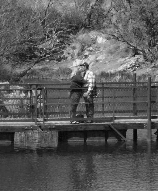 Kissing on a bridge