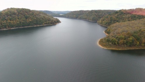 Fall Color near Smithville showing the Caney Fork River in Tennessee.  The red dash on the top right is the drone propeller.  The drone is red and black.