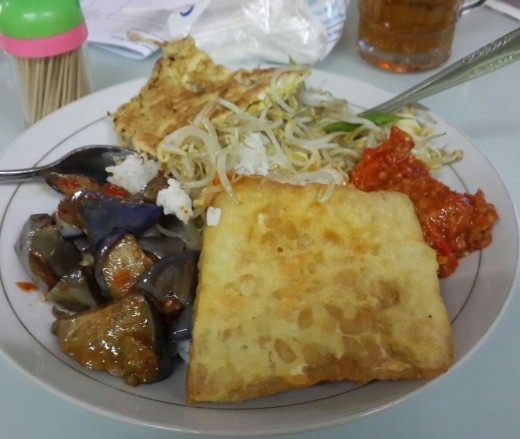 Mixing and matching with nasi rames, a simply but satisfying serving of rice with an array of samplings