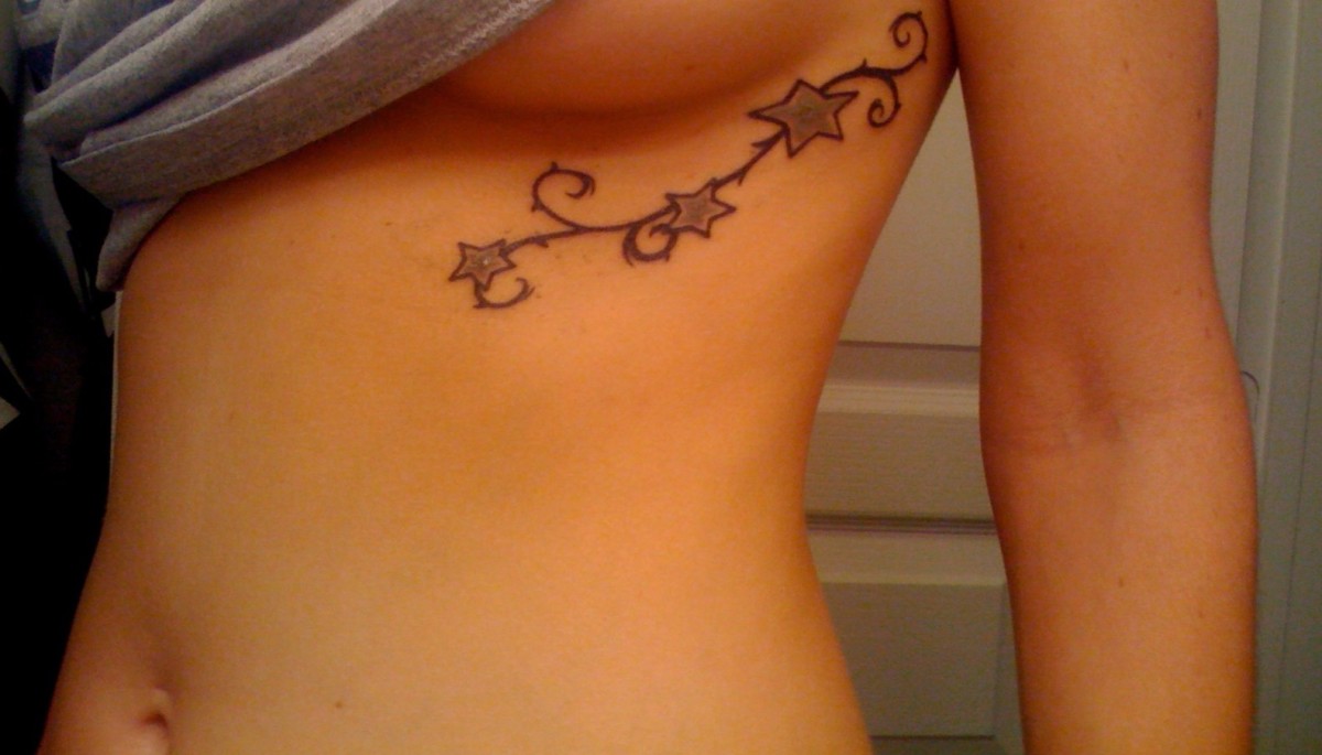 rib cage tattoos after pregnancy