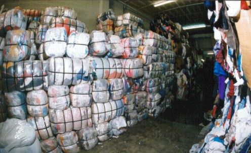 Bundles of used clothing ready for export by "The Attic" Co.  (Photo credit, The Attic)