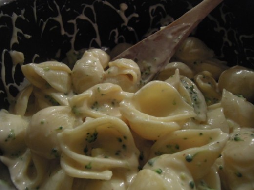 Comforting gluten free vegan cheesy pasta with broccoli.