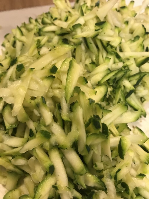 You'll need two full cups of freshly grated zucchini - about 2 small or one large. This adds flavor, moisture and fiber to the bread.