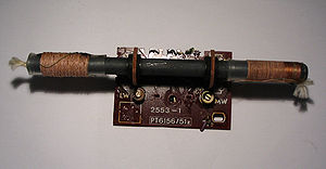 Ferrite-core antenna common in portable AM receivers.