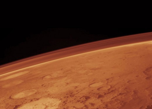 The atmospheric pressure on Mars is orders of magnitude lower than on Earth, and the composition is not breathable for humans.