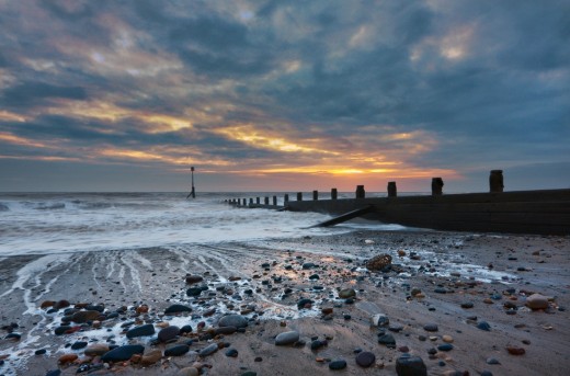 Hornsea beach at dawn, with one of the 'groins' that prevents the sands from shifting along the coast with the strong shore currents