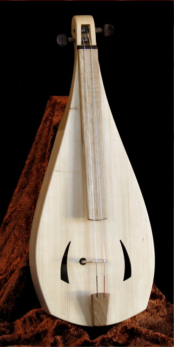 Carved wood guitar; a musical art piece. 