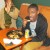 This young man came with his mom and sisters. He is enjoying some of the delicious food during the game as well. This young man came with his mom and sisters. He is enjoying some of the delicious food during the game as well.