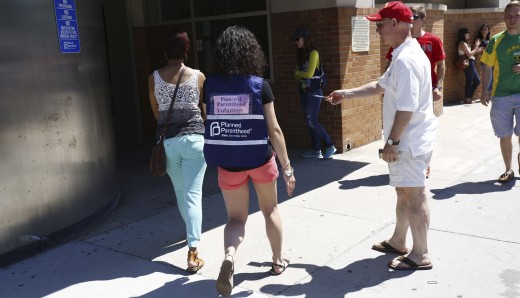 After the Supreme Court’s decision last summer, a protester approaches a patient walking in the door of the Boston Planned Parenthood. 