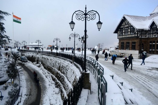 People stroll in the snow in Shimla