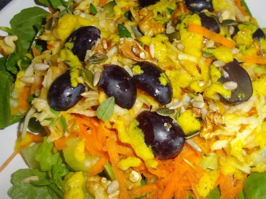 Carrot salad with black grapes and sunflower seeds.