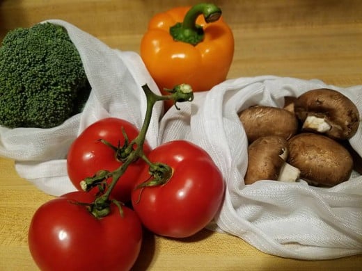 Package free produce in reusable produce bags.