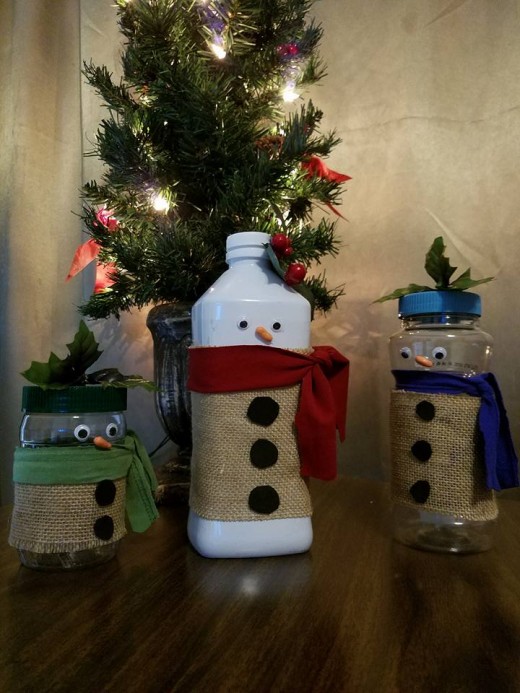 Upcycled Snowman Craft; reusing milk, peanut, and peanut butter jars, scrap fabric, and t-shirt remnants.