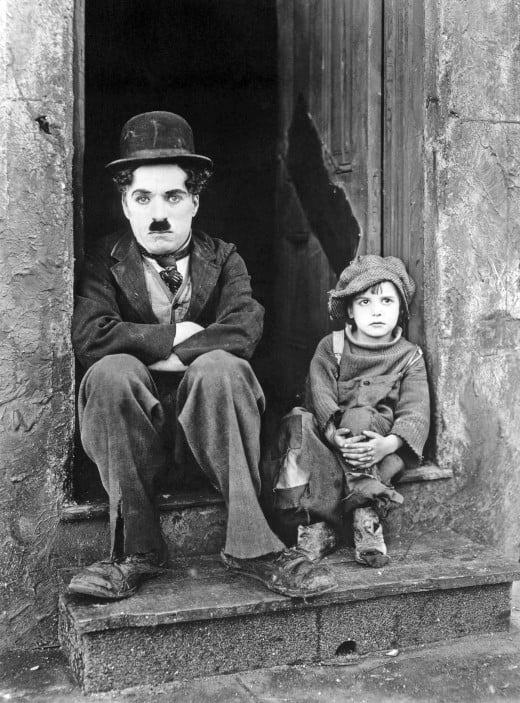  Charlie Chaplin and Jackie Coogan in the film The Kid