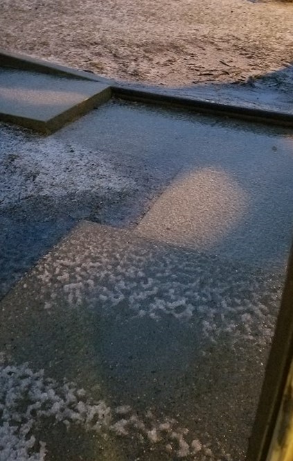 Rain freezing to the ground. 