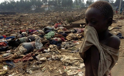 A child covers his nose from the stench of decaying bodies during the 1994 Rwandan Genocide
