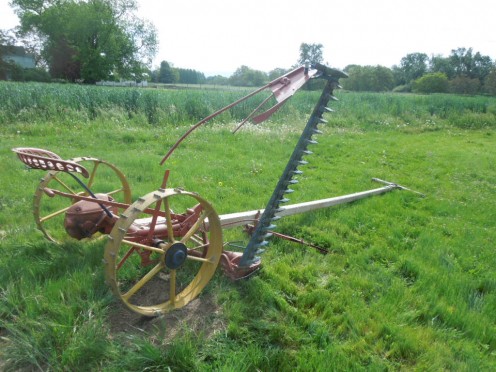 A horse drawn John Deere mower