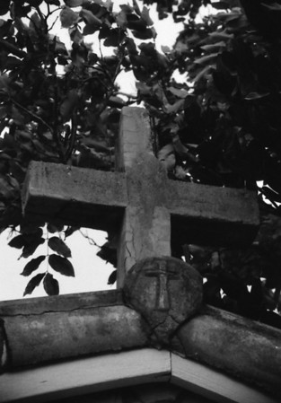 Check out the tiny cross.