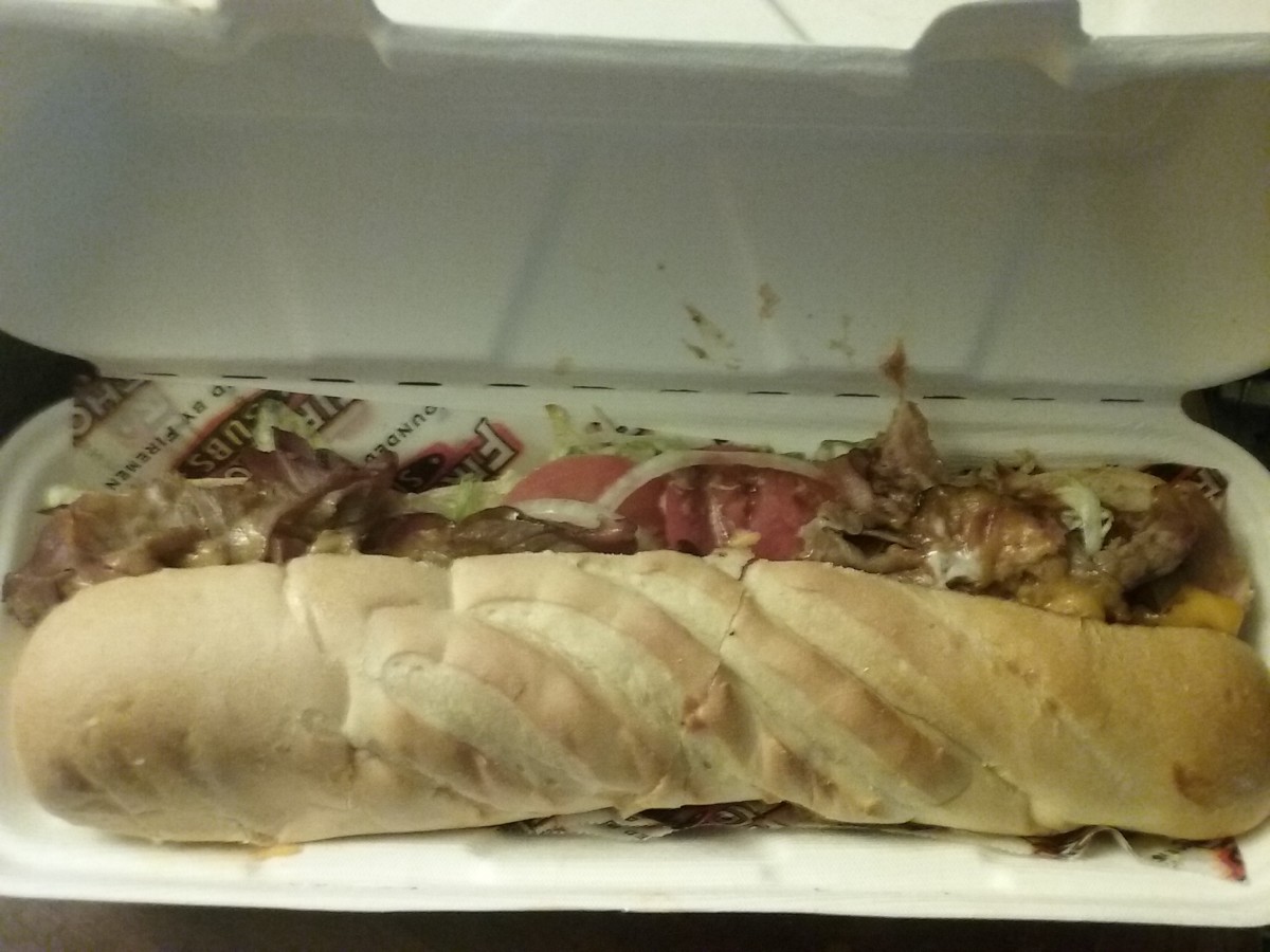 Beef brisket sub from firehouse subs. This beef brisket sub includes lettuce, slices of tomatoes, slices of onions and melted cheese. 