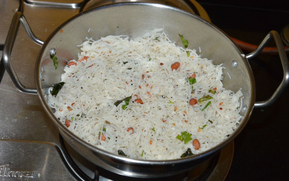 Turn on the heat to medium low. Stir the mixture once or twice. Once the sevai becomes warm, turn off the heat. Your favorite rice vermicelli upma is ready!