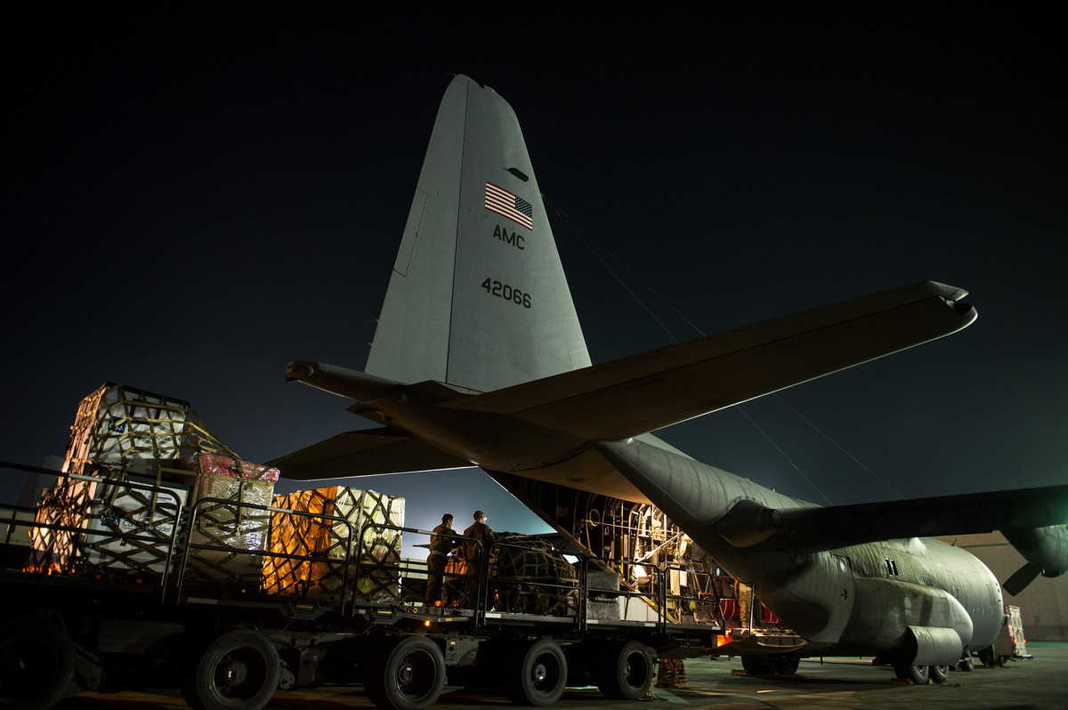 774th Expeditionary Airlift Squadron load pallets on a C-130H; serving Afghanistan.