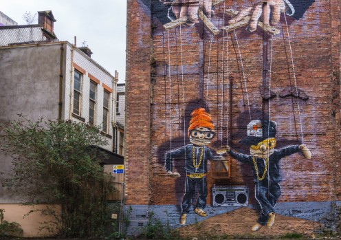 'Hip Hop Marionettes' Street Art on the side of a building in Glasgow